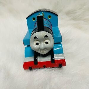 piggy bank shaped like Thomas the Tank Engine from the Thomas & Friends series
